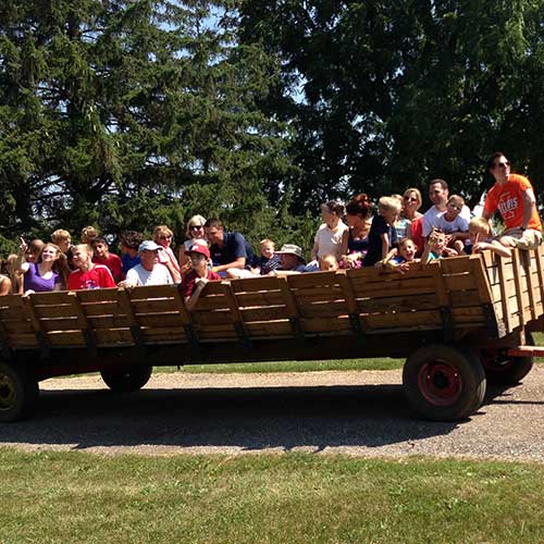 Reserve a private wagon ride around our fall farm this u-pick pumpkin season! data-verified=